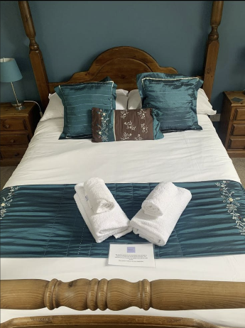 Airbnb bedroom reset with fresh soft furnishings